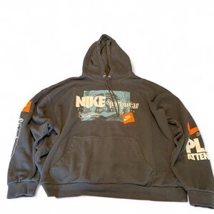 Nike Men’s Charcoal Graphic Hoodie with Orange Accents